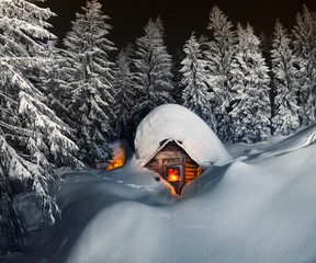 fairy-tale snow-covered house in the mountains