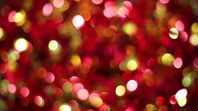 Defocused colourful bokeh abstract noel  lights background of yellow and red  colors. Copyspace. Real time full hd video footage.