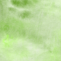 Green watercolor bright texture. Abstract washes and brush strokes on the white paper background.