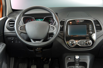 steering wheel and a board with instruments of a luxury passenger car