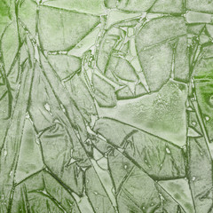 Watercolor green abstract texture with washes and brush strokes on the white paper background.