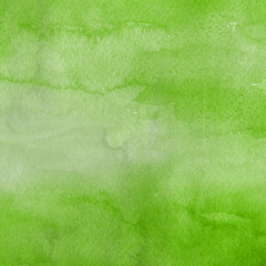 Watercolor green texture with abstract washes and brush strokes on the white paper background.
