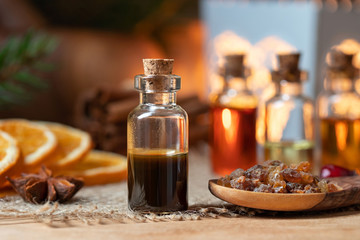 A bottle of myrrh essential oil with myrrh resin