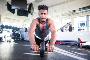 young man exercising in gym