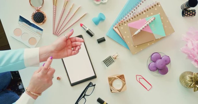 Overhead Of Female Fashion Blogger Testing Perfume On Hands 4K