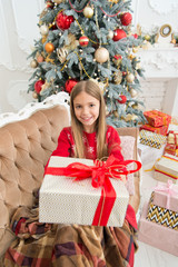 Obraz na płótnie Canvas This is for you. Happy child celebrate christmas and new year. Child girl prepare for boxing day holiday. Little girl with gift box. Boxing day is the day after Christmas. Happy new year