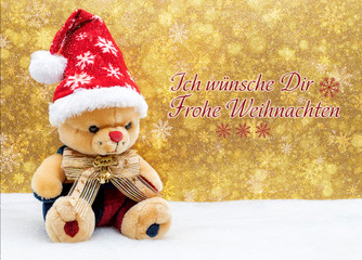 Weihnachtliche Grußkarte mit Teddy und roter Weihnachtsmütze.