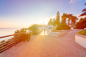 healthy lifestyle sports woman running on wooden boardwalk sunrise seaside
