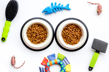 Pet care, feed and training on white background top view
