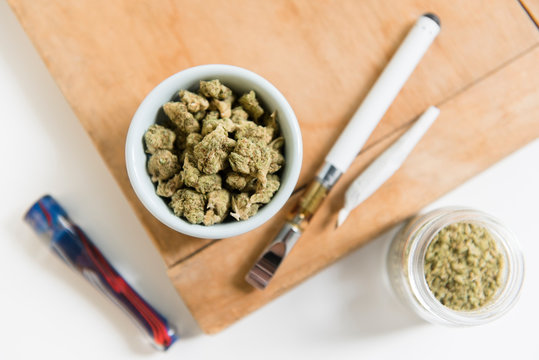 Bowl of marijuana with electronic cigarette and joint