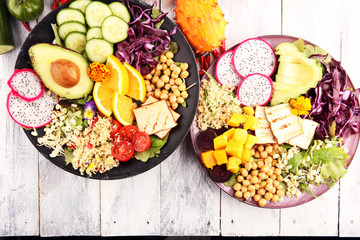 grilled tofu and dragon fruit buddha bowl with vegetable and humus