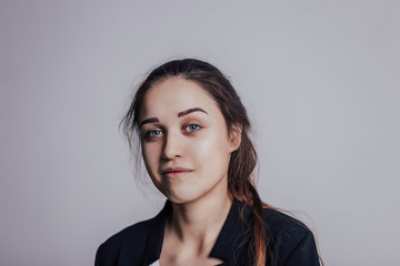 Obraz premium I'm relaxed and confident in my self. Tender and pretty girl with relaxed face looking at camera. Young woman with slight smile
