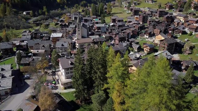 Rural Swiss Alps village with wooden barns