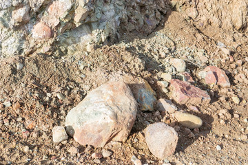 Rocks fall from hillside after rain storm