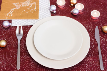 An empty plate on christmas eve table