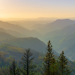 A misty sunset over the mountains and valley of Yosemite National Park