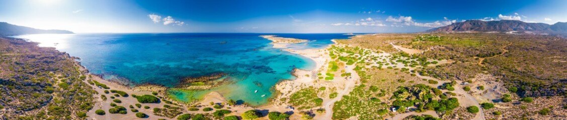 Aerial view of Elafonissi beach on Crete island with azure clear water, Greece, Europeof Elafonissi...