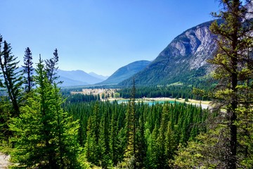 Elevated view of Trans Canada Highway leading past Cascade Ponds into Banff National Park