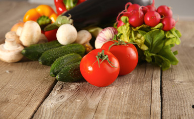 Composition with assorted raw organic vegetables wooden table