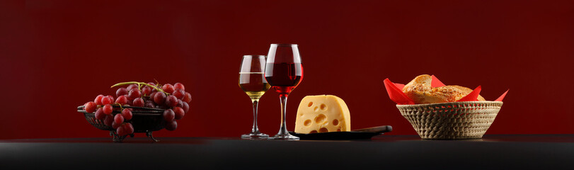 Large-format panorama with red and white wine, cheese and grapes