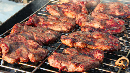 Process of cooking meat. Steak on barbecue. Preparation appetizing pork outside