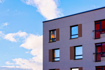 Part modern apartment house copy space blue sky clouds