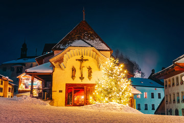 Catholic church in Gruyeres town village in Switzerland winter night