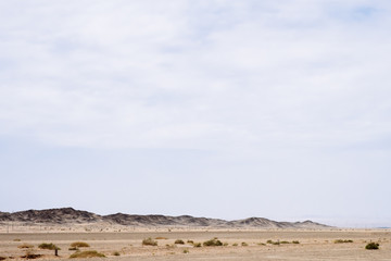 Fototapeta na wymiar Mountains in the gobi desert near Dunhuang, in northwestern China
