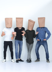 group of young people with paper bags on their heads