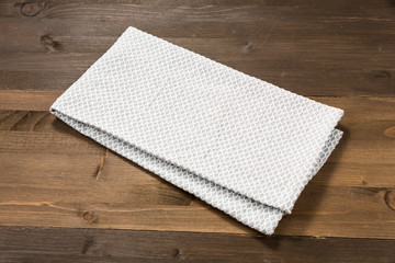 White tablecloth isolated on wooden background
