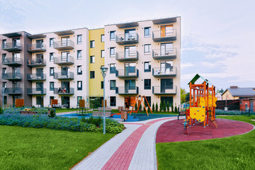 Fototapeta premium Modern house new residential apartment building exterior children playground
