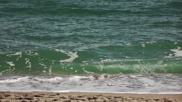 Panoramic view of storm sea waves roll on sandy coast at summer day. Slow motion, Full HD video, 240fps, 1080p.