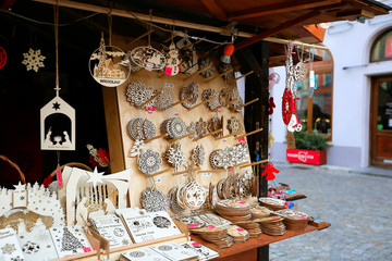 Beautiful wooden multi-colored Christmas toys for decorating house at Christmas Market. Xmas market...