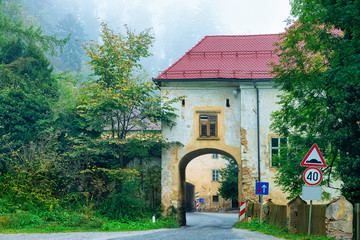 Cityscape with arch of house at road in Slovenia
