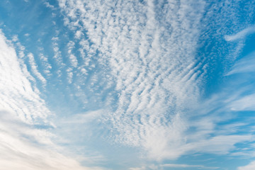 Beautiful blue sky with spindrift clouds.