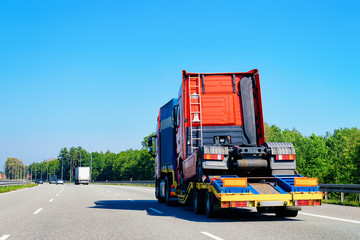 Truck transporter carrying lorry cabin in highway road in Slovenia
