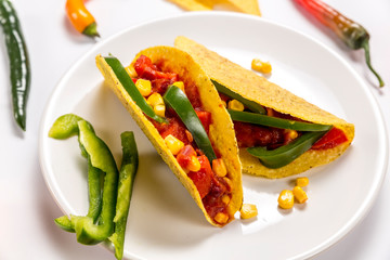Stuffed colorful burritos on a white background