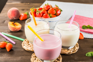 Colorful milkshakes on a wooden table