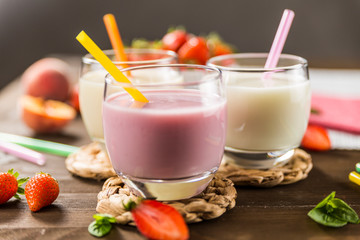 Colorful milkshakes on a wooden table