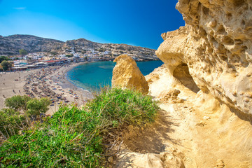 Matala beach on Crete island with azure clear water, Greece, Europe