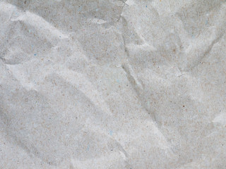 Crumpled recycled gray packing paper