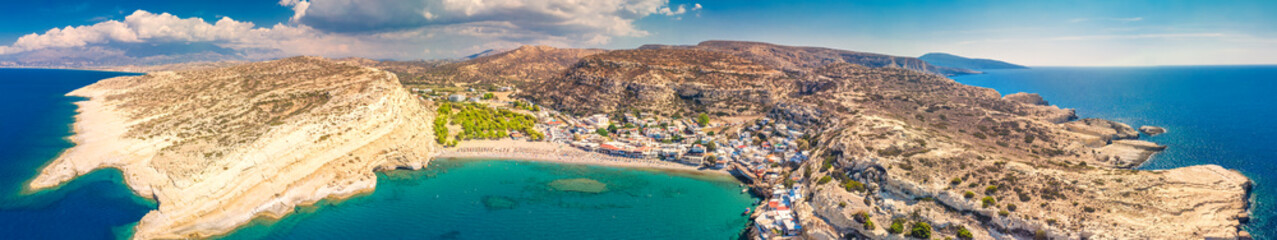 Fototapeta na wymiar Aerial view of Matala beach on Crete island with azure clear water, Greece, Europe