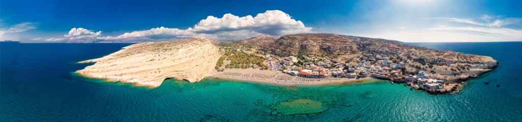 Obraz na płótnie Canvas Aerial view of Matala beach on Crete island with azure clear water, Greece, Europe