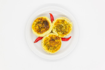 Cheese pies with pepper on a plate