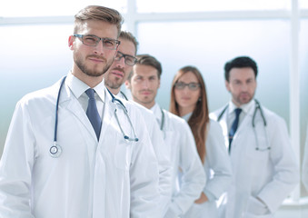 team of doctors standing in the hospital corridor