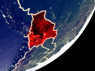 Bolivia from space on model of Earth at night. Very fine detail of the plastic planet surface and visible bright city lights.