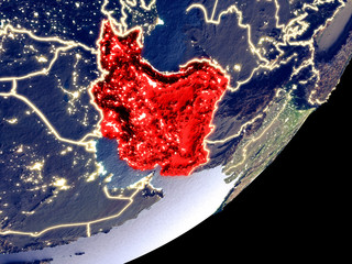 Iran from space on model of Earth at night. Very fine detail of the plastic planet surface and visible bright city lights.