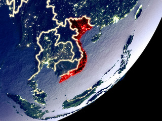 Vietnam from space on model of Earth at night. Very fine detail of the plastic planet surface and visible bright city lights.