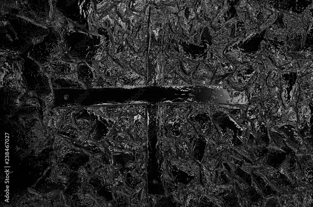 Aufkleber the background consists of a gray abstract texture and a drawn cross.