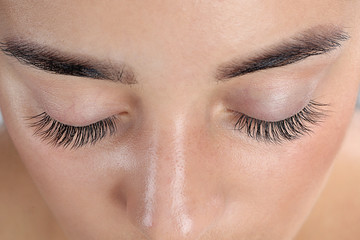 Fototapeta premium Young woman with beautiful eyelashes, closeup view